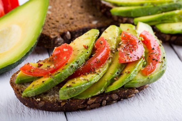 Avocado sandwich and tomatoes Avocado sandwich and tomatoes