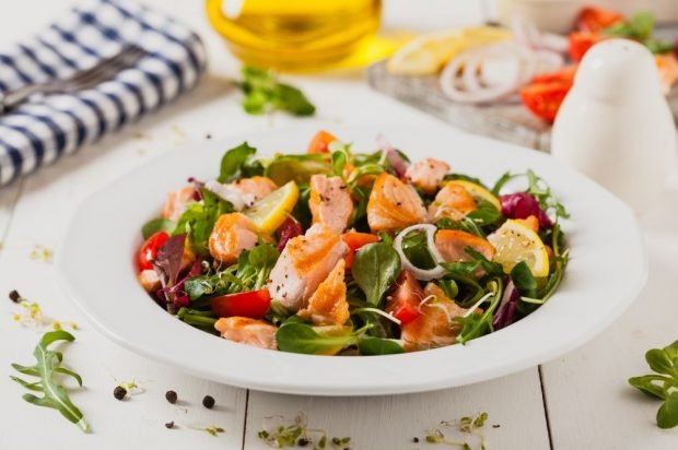 Baked red fish, tomatoes and greenery Baked red fish, tomatoes and greenery