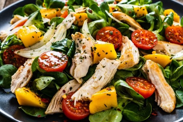 Chicken salad, cherry tomatoes and pumpkin