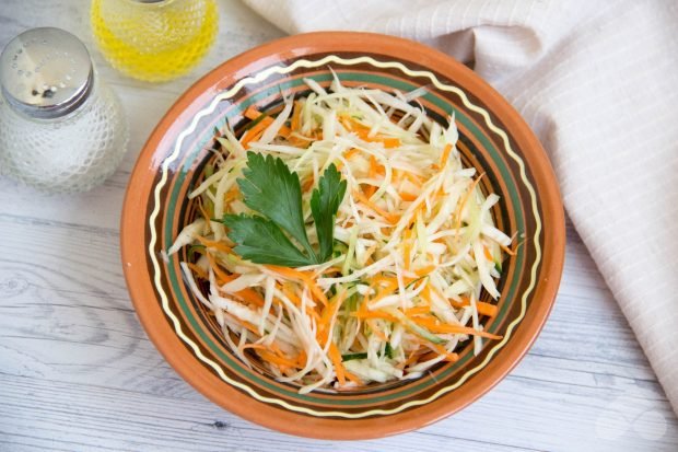 Fast salad of cabbage, carrots and cucumber