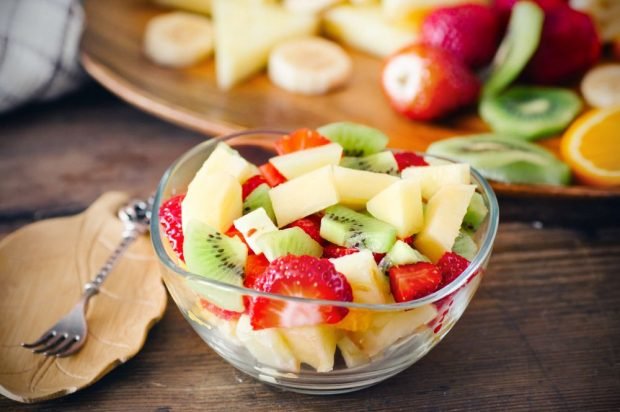 Fruit salad of melon, strawberries and kiwi Fruit salad of melon, strawberries and kiwi