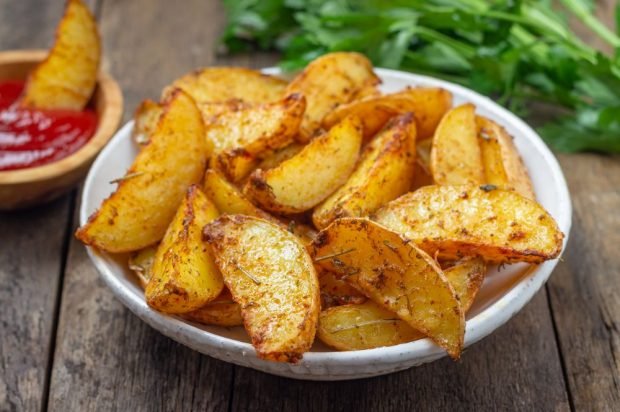 Golden potatoes are in a rustic Golden potatoes are in a rustic