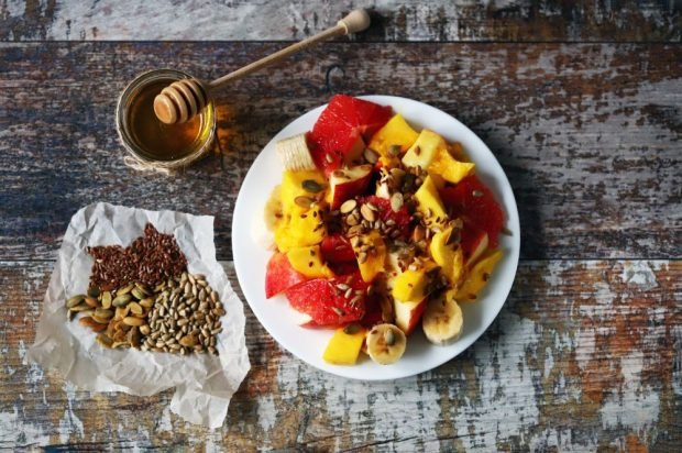 Grapefruit, mango, banana and apples fruit salad Grapefruit, mango, banana and apples fruit salad