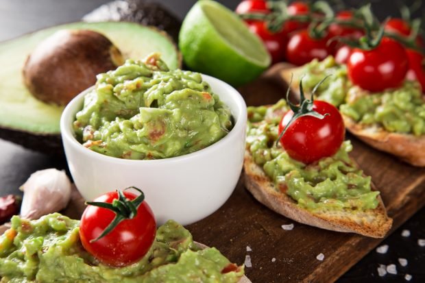 Guacamole with avocado and tomatoes Guacamole with avocado and tomatoes