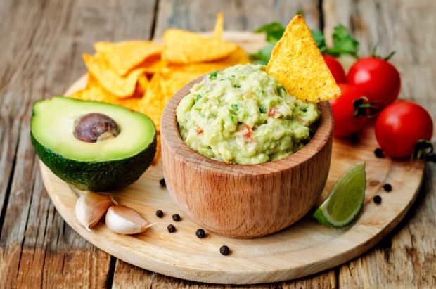 Guacamole with avocado, tomatoes and garlic Guacamole with avocado, tomatoes and garlic