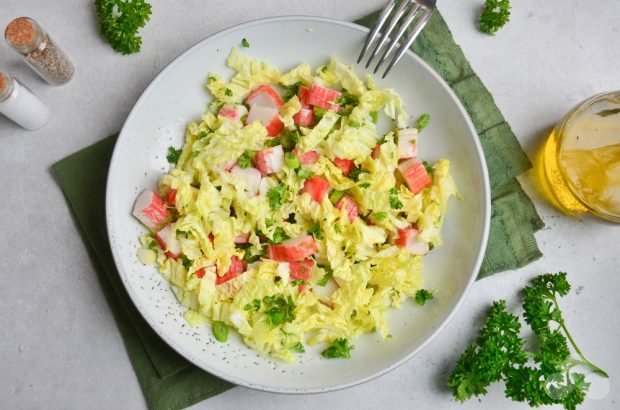 Peking cabbage salad, crab sticks and green onions Peking cabbage salad, crab sticks and green onions