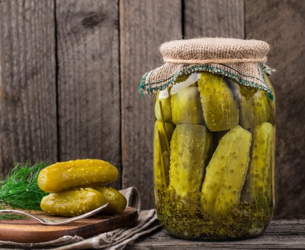 Pickled cucumbers with vinegar for the winter in banks