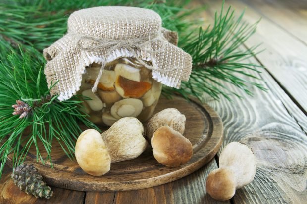 Pickled white mushrooms in banks for the winter Pickled white mushrooms in banks for the winter