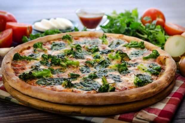 Pizza with broccoli, mozzarella and spinach Pizza with broccoli, mozzarella and spinach