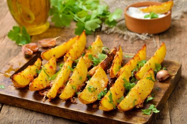 Potato in a rustic with garlic and herbs Potato in a rustic with garlic and herbs