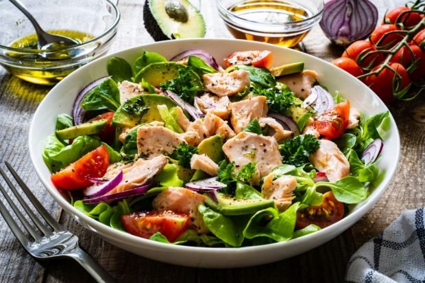 Salad with boiled red fish, avocado and cherry tomatoes Salad with boiled red fish, avocado and cherry tomatoes