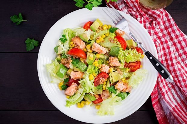 Salad with fried red fish, corn and avocado Salad with fried red fish, corn and avocado
