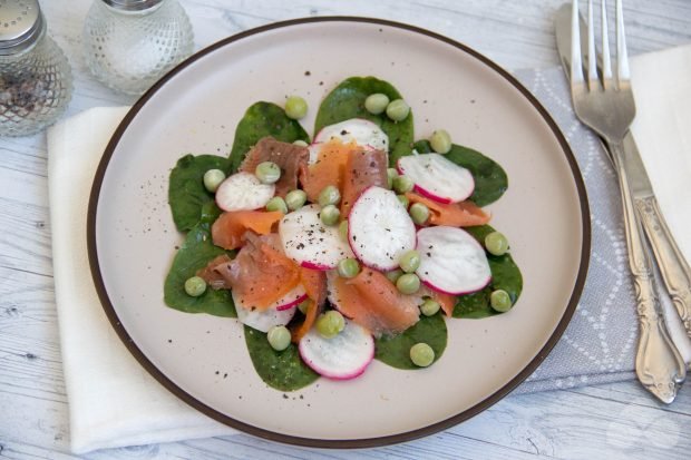 Salad with red fish, spinach, radish and green peas Salad with red fish, spinach, radish and green peas