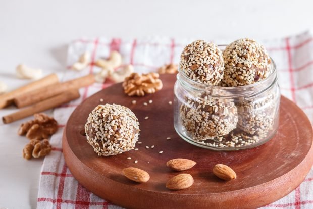 Sweets with almonds in sesame seeds