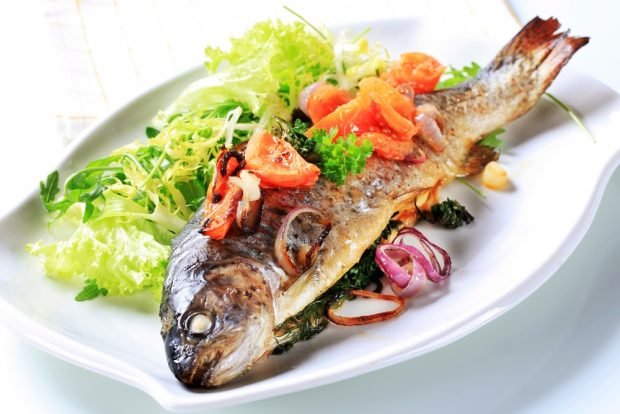 Trout with tomatoes and greens in the oven Trout with tomatoes and greens in the oven